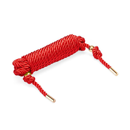 Red Shibari Rope coiled neatly – silky cotton bondage rope for Japanese rope play and sensual restraint.