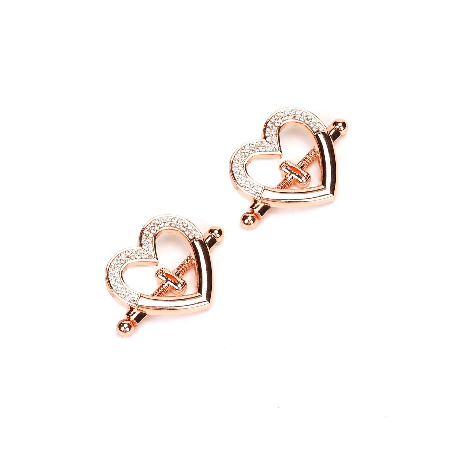 Rose gold heart-shaped nipple clamps with rhinestones on white background.