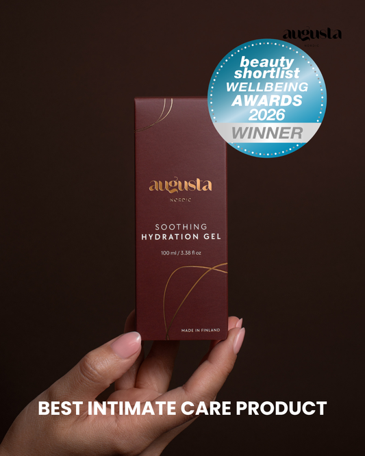 Hand holding a box of Augusta Soothing Hydration Gel with an award badge on a dark background