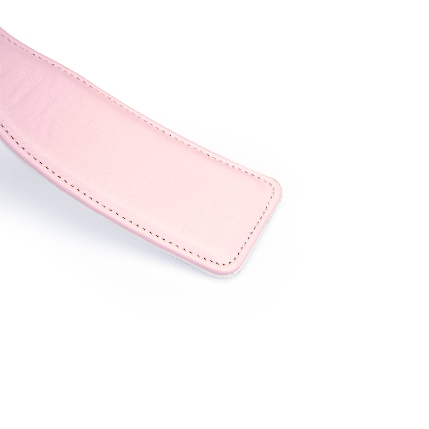 white and pink paddle close up for impact play for couples